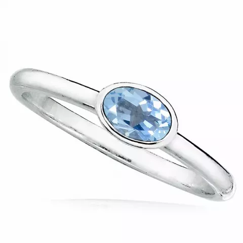 oval blå ring i rhodinerat silver