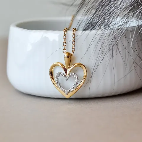 Hjärta diamant hängen i 14 carat guld- och vitguld 0,18 ct