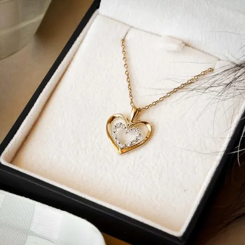 Hjärta diamant hängen i 14 carat guld- och vitguld 0,18 ct