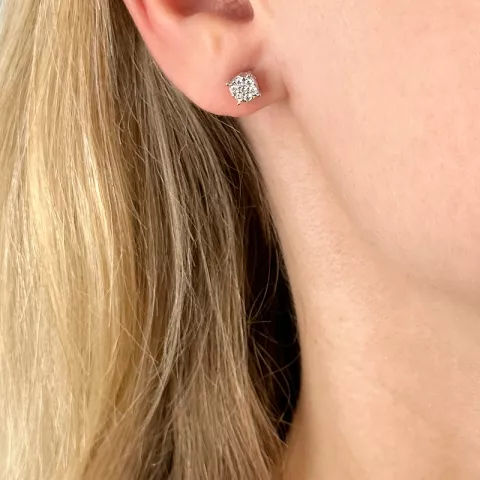 runda diamant örhängestift i 14 karat vitguld med diamant 