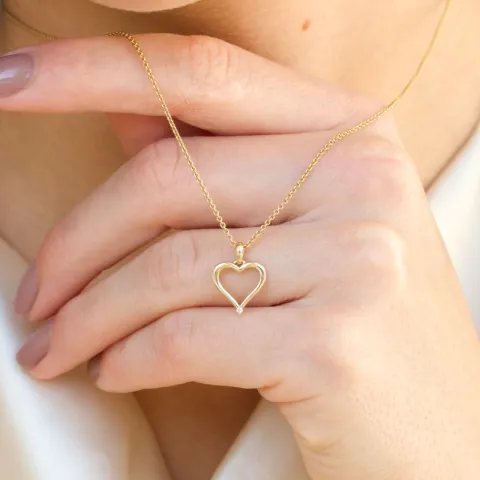 hjärta diamantberlocker i 14  carat guld 0,01 ct