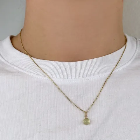 runt grön hängen i 9 karat guld