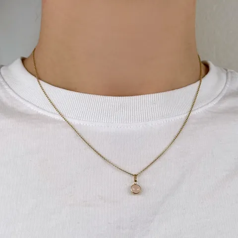 Elegant runt hängen i 9 karat guld