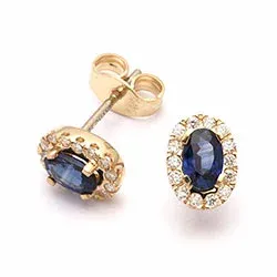 ovala safir örhängen i 14 karat guld med diamant och safir