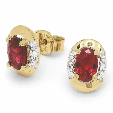 ovala röda örhängen i 9 karat guld med rhodium med 