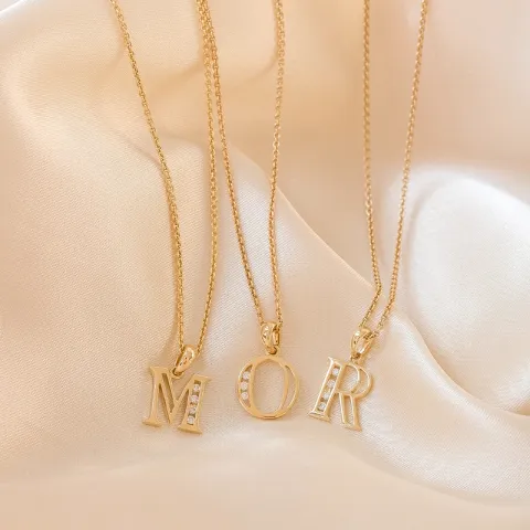 bokstav r hängen i 14  carat guld 0,04 ct