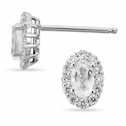 ovala diamant örhängestift i 14 karat vitguld med diamant och kvarts