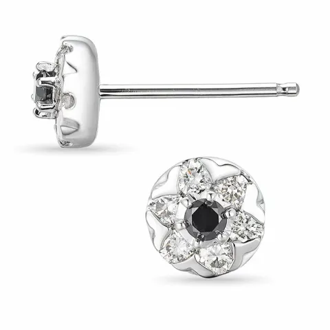 runda diamant örhängestift i 14 karat vitguld med diamant och svart diamant