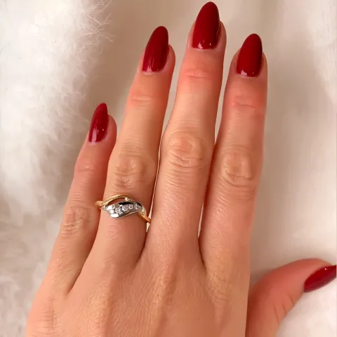 abstrakt diamant ring i 14  karat guld- och vitguld 0,12 ct