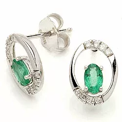 ovala smaragd örhängestift i 14 karat vitguld med diamant och smaragd 