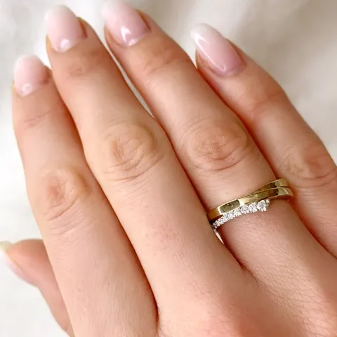 abstrakt diamantring i 14 karat guld- och vitguld 0,115 ct