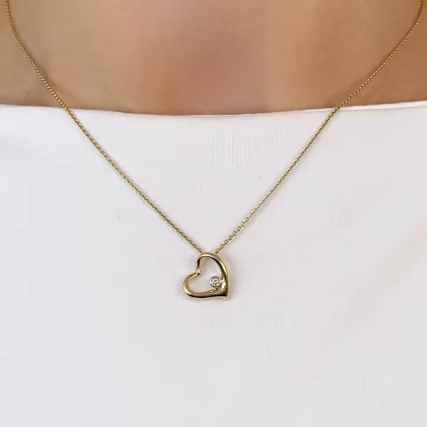 äkta hjärta diamantberlocker i 14 carat guld 0,03 ct