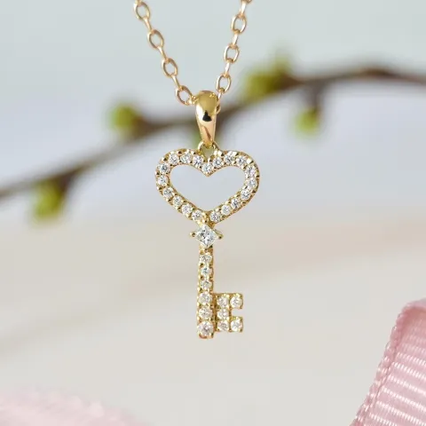 nyckel diamantberlocker i 14 carat guld 0,21 ct