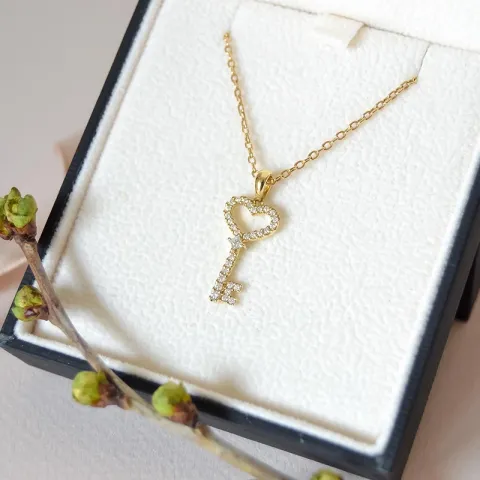 nyckel diamantberlocker i 14 carat guld 0,21 ct