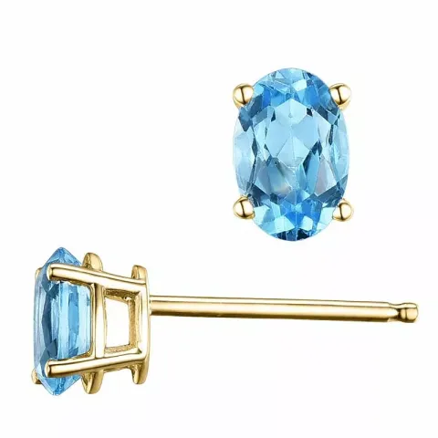 2 x 0,60 ct ovala topas örhängestift i 14 karat guld med topas 