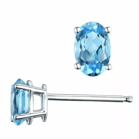2 x 0,60 ct ovala blå topas örhängestift i 14 karat vitguld med topas 