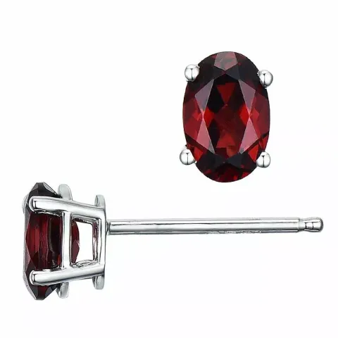 2 x 0,68 ct ovala röda granat örhängestift i 14 karat vitguld med granat 