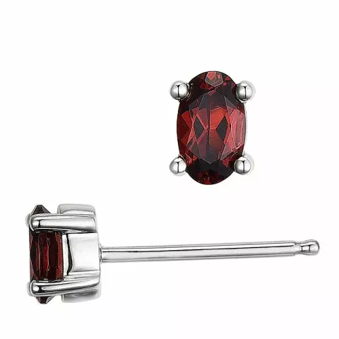 ovala granat örhängestift i 14 karat vitguld med granat 