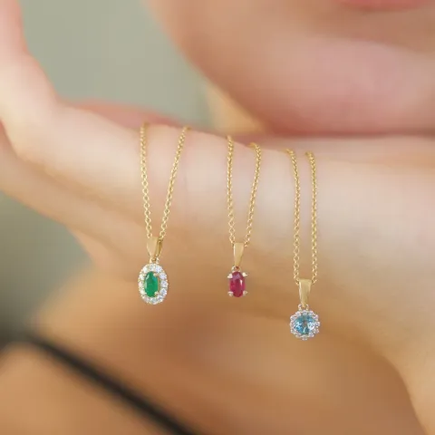 ovalt smaragd diamantberlocker i 14  carat guld 0,25 ct 0,15 ct