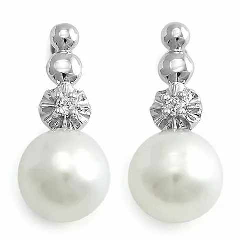 Vita pärla örhängestift i 14 karat vitguld med diamanter 