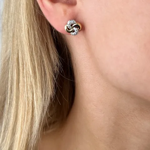 diamant örhängestift i 14 karat guld och vitguld med diamant 