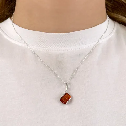 Abstrakt fyrkantigt bärnsten hängen i silver