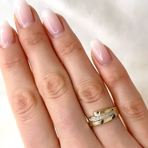 elegant abstrakt diamant ring i 9 karat guld- och vitguld 0,03 ct