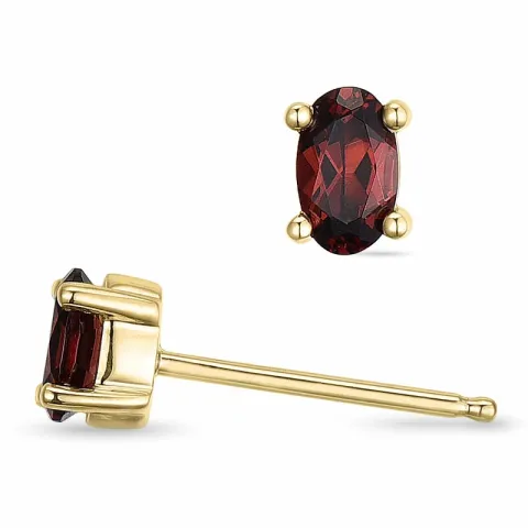 ovala granat solitäreörhängestift i 9 karat guld med granat 