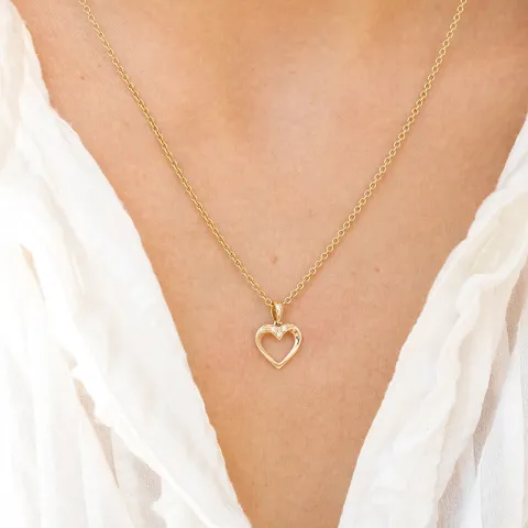 hjärta diamantberlocker i 14  carat guld 0,01 ct