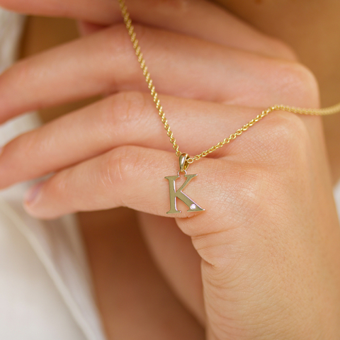 bokstav k diamant hängen i 9 carat guld 0,01 ct