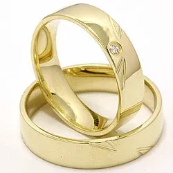 Elegant vigselsringar i 14  karat guld 0,025 ct - set
