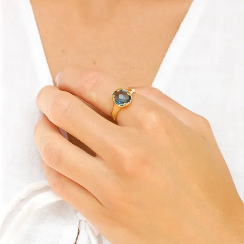 mörkblå kristal ring i förgylld mässing