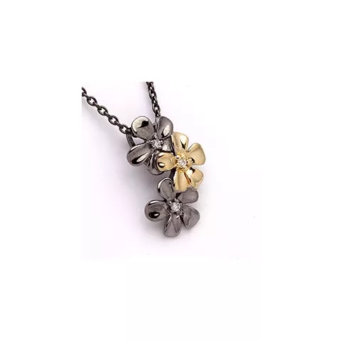 Dark Harmony blommor hängen i svart rhodinerat silver och förgyllt silver