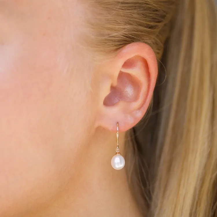 Ovala 7 - 8 mm aaa-graderad sötvattenspärla örhängen i 14 karat guld med 