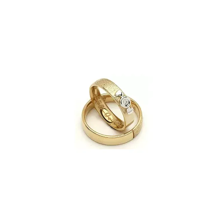 Vigselsringe från rs of scandinav i 8 karat guld- och vitguld 0,02 ct