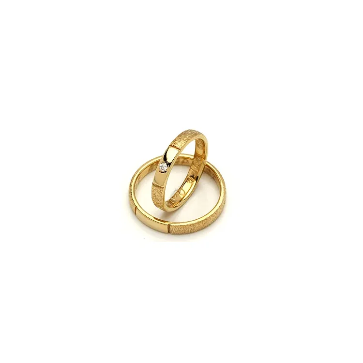 Vigselsringe från rs of scandinav i 14  karat titan och vanl. Guld 0,02 ct