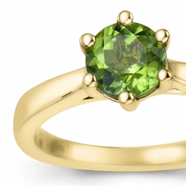 grön peridot solitärring i 14 karat guld 1,27 ct