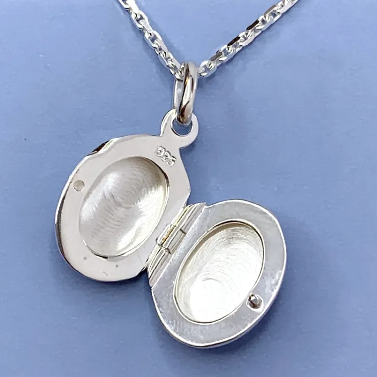 12 x 15 mm ovalt medaljong i silver