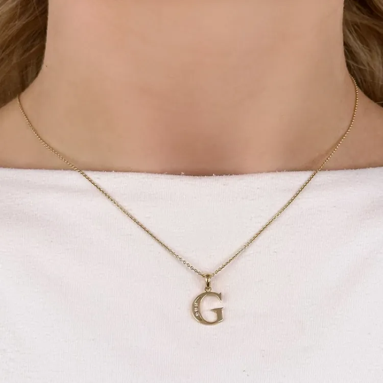 bokstav g hängen i 14 carat guld 0,03 ct