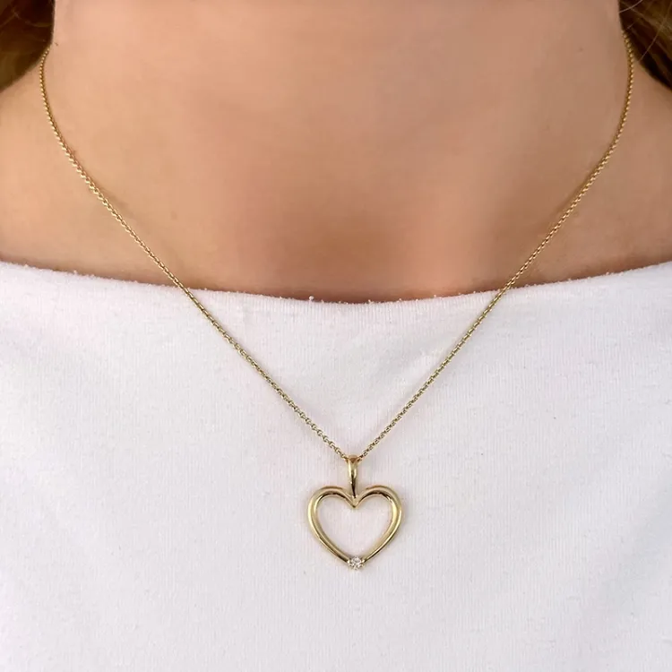 hjärta diamantberlocker i 14  carat guld 0,02 ct