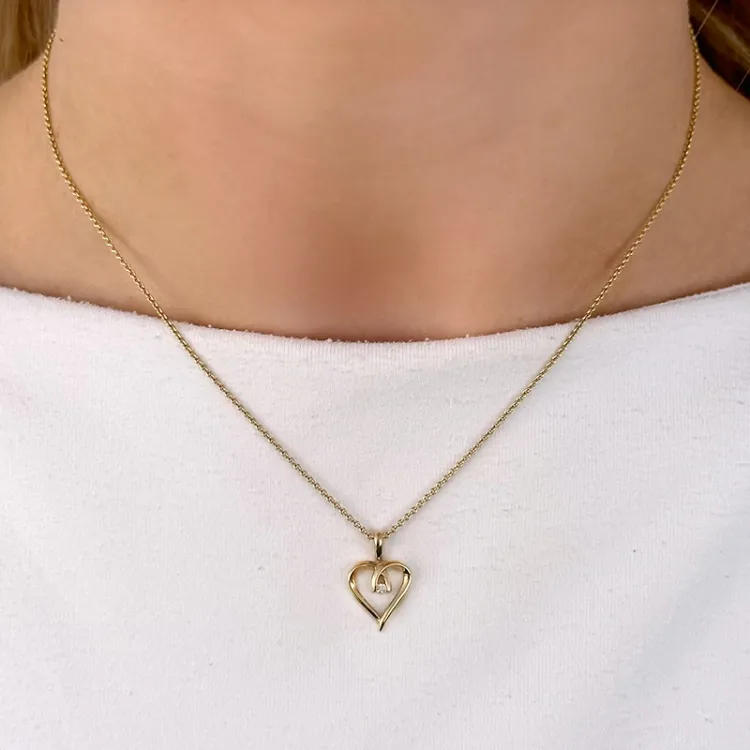 hjärta diamantberlocker i 14  carat guld 0,02 ct
