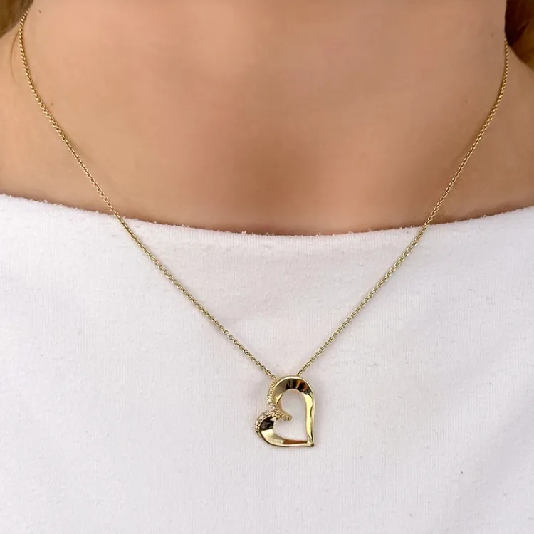 hjärta diamantberlocker i 14  carat guld 0,06 ct