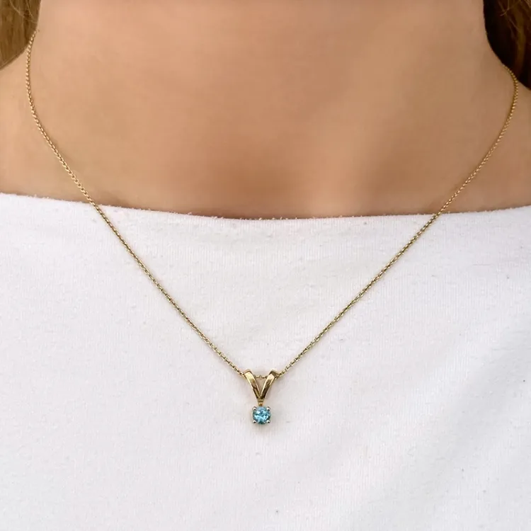 blå topas hängen i 14 carat guld 0,30 ct