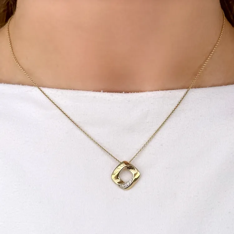 diamantberlocker i 14  carat guld- och vitguld 0,05 ct
