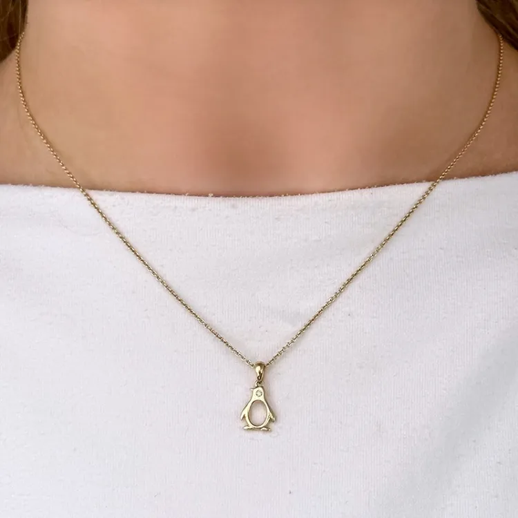 pingvin diamant guldberlocker i 14  carat guld 0,01 ct