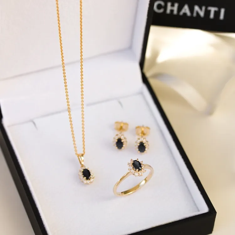 safir rosettörhängestift i 14 karat guld med diamant och safir 