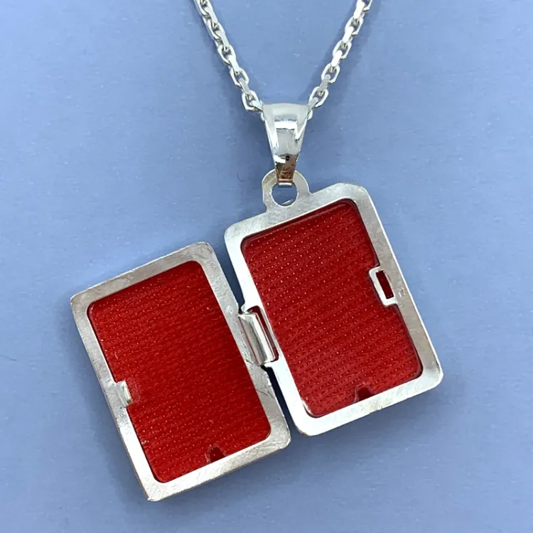 medaljong i silver