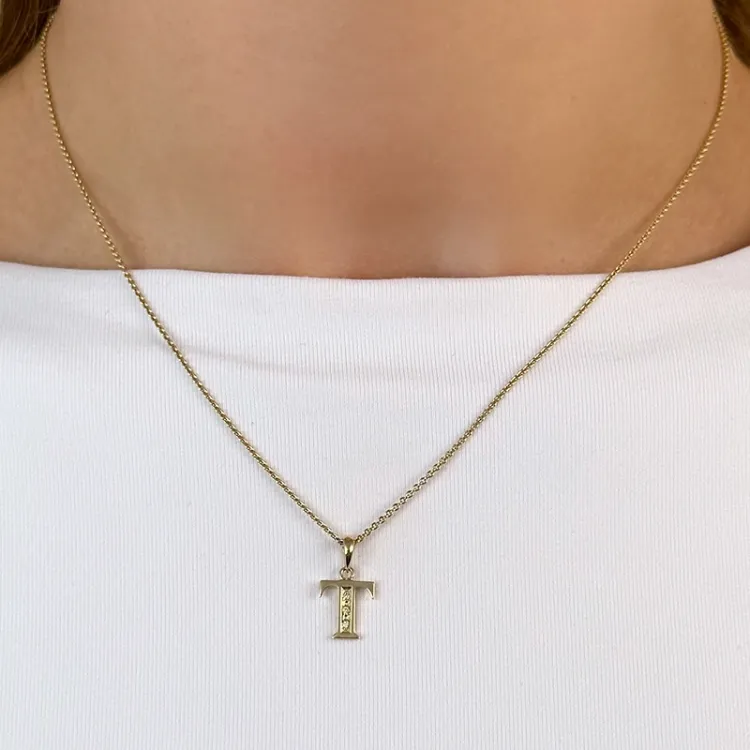 bokstav t diamant hängen i 9 carat guld 0,02 ct