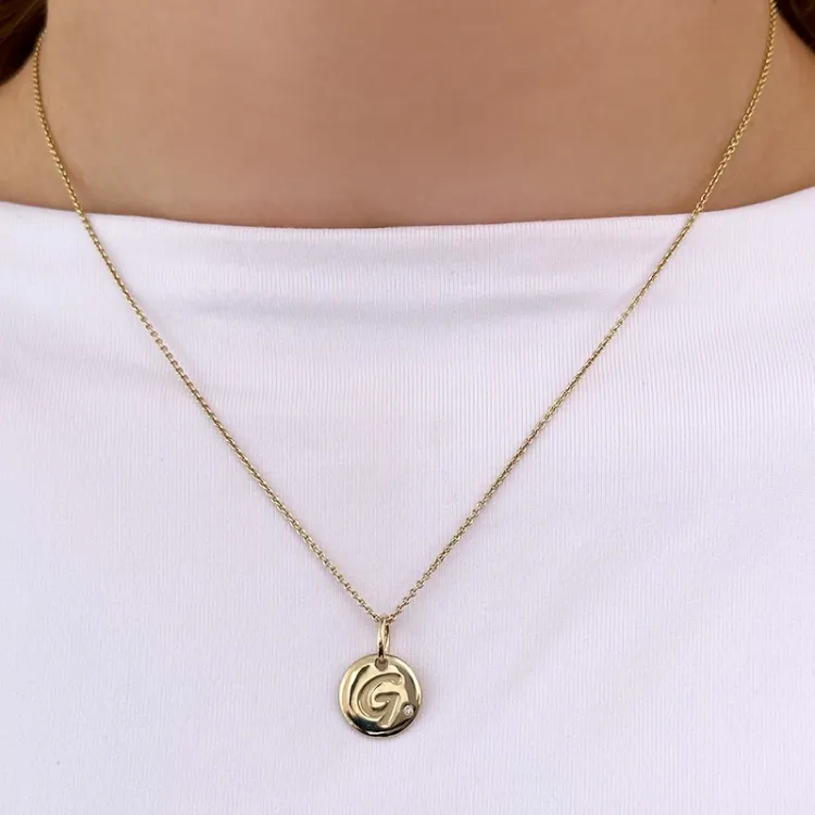 bokstav g diamant hängen i 9 carat guld 0,01 ct