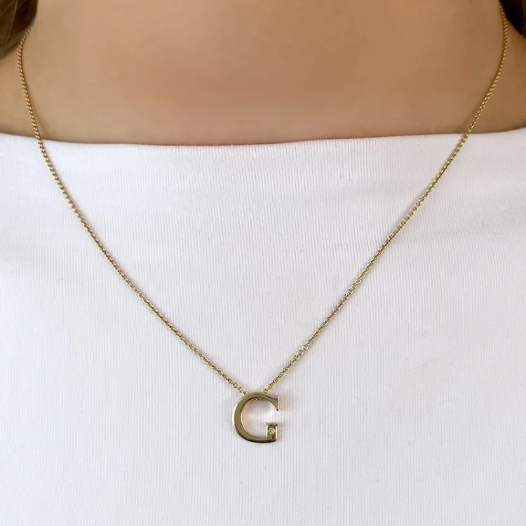 bokstav g diamant hängen i 9 carat guld 0,01 ct